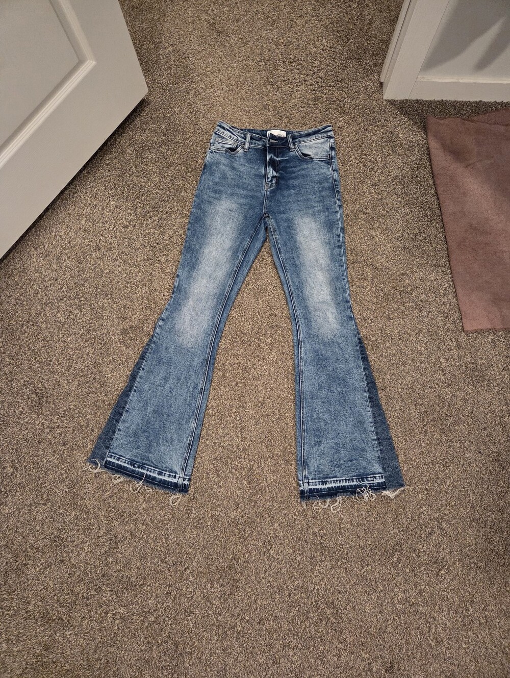 High-Rise Blue Flare Jeans with Raw Hem